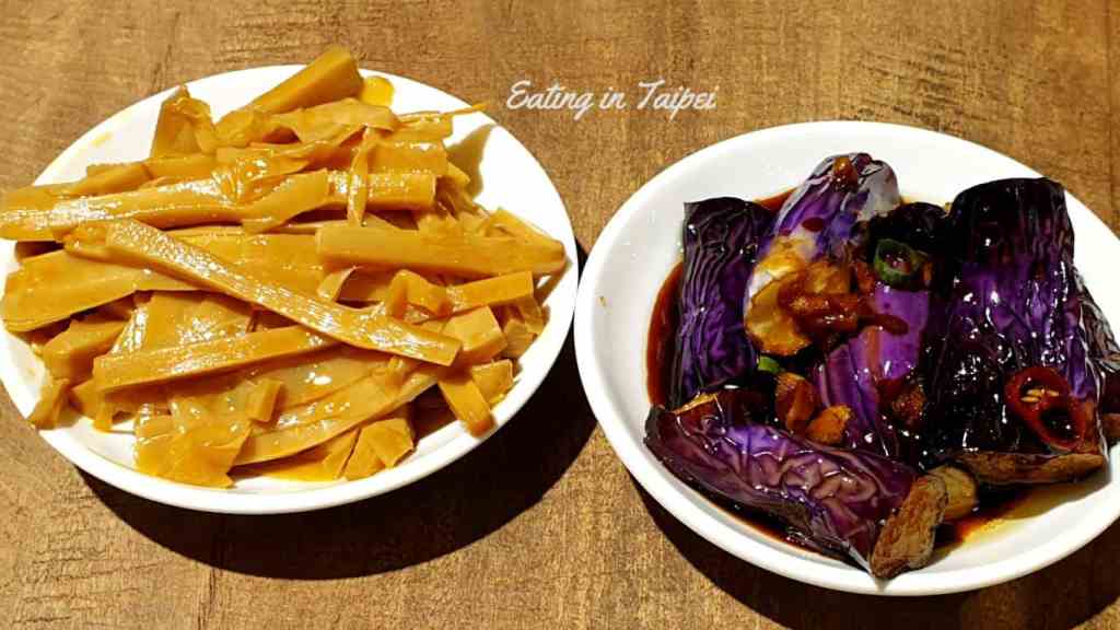 Here is a side dish of bamboo shoots and also one of spiced aubergine. The deep purple of the aubergine pops, and the deep golden colour of the bamboo eludes to being soaked in soy sauce.